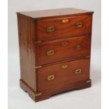 A late 19th century brass bound teak campaign chest, the three long drawers having flush brass