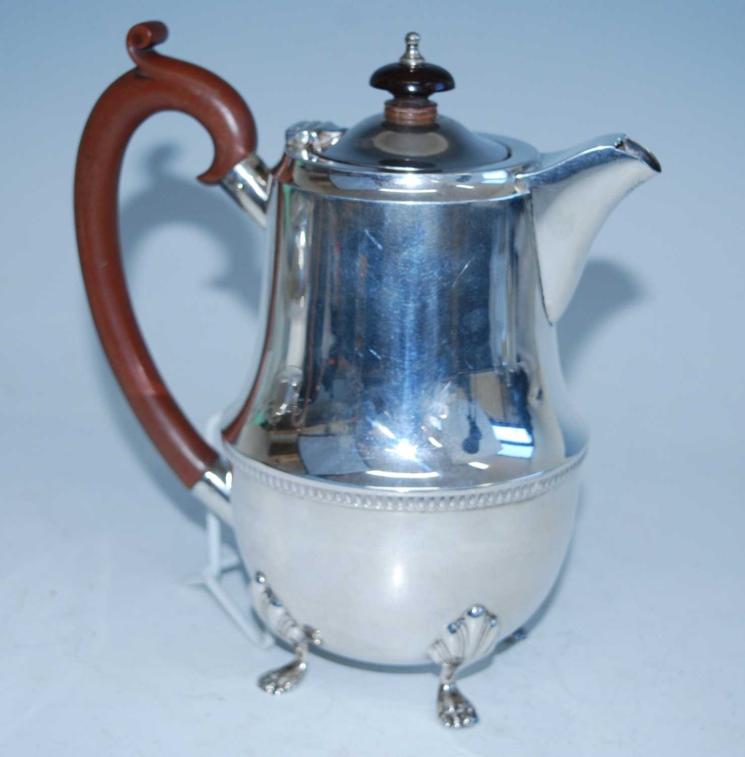 A mid-20th century silver four-piece tea set, comprising teapot, hot water pot, sugar and cream, - Image 7 of 10