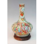 A 19th century Chinese Canton famille rose vase, the slender neck leading to a squat globular