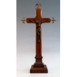 A Victorian parcel gilt carved oak crucifix, the corpus christi above a cavetto moulded base, h.