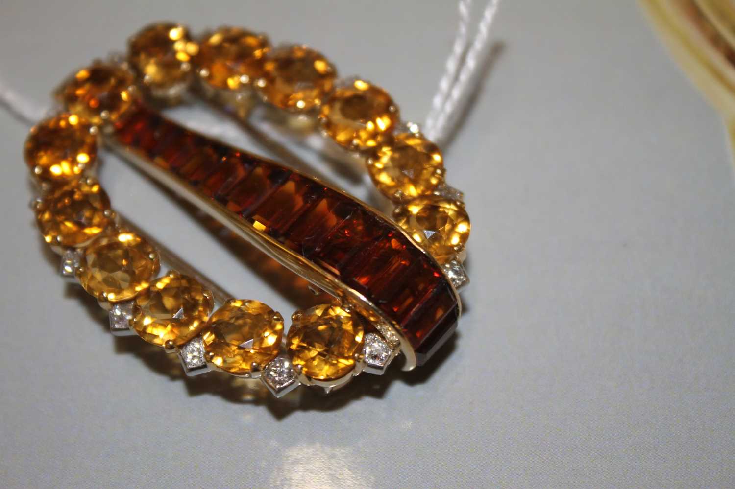 A yellow metal signed Cartier London citrine, topaz and diamond clip brooch, comprising a central - Image 10 of 11