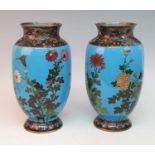 A pair of Japanese Meiji period cloisonne enamel vases, each of ovoid form, decorated with birds