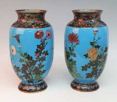 A pair of Japanese Meiji period cloisonne enamel vases, each of ovoid form, decorated with birds