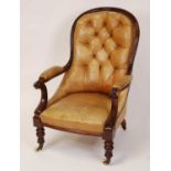 A mid-Victorian mahogany framed and tan leather buttoned upholstered gentleman's spoonback armchair,