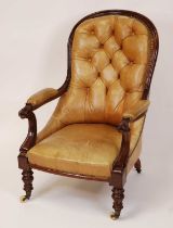 A mid-Victorian mahogany framed and tan leather buttoned upholstered gentleman's spoonback armchair,
