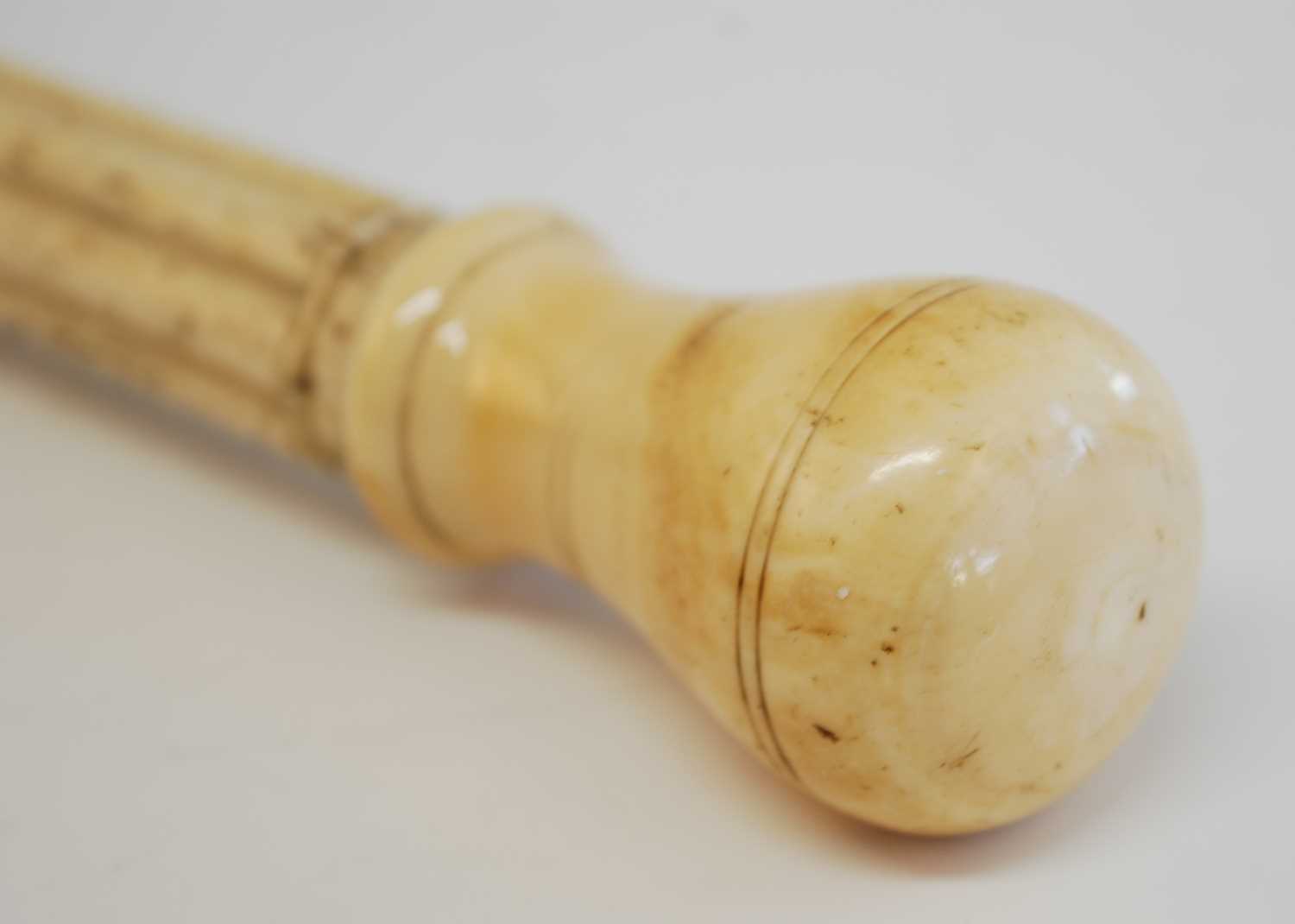 A 19th century narwhal tusk carved walking stick, the shaft carved with reeded top section and - Bild 3 aus 8