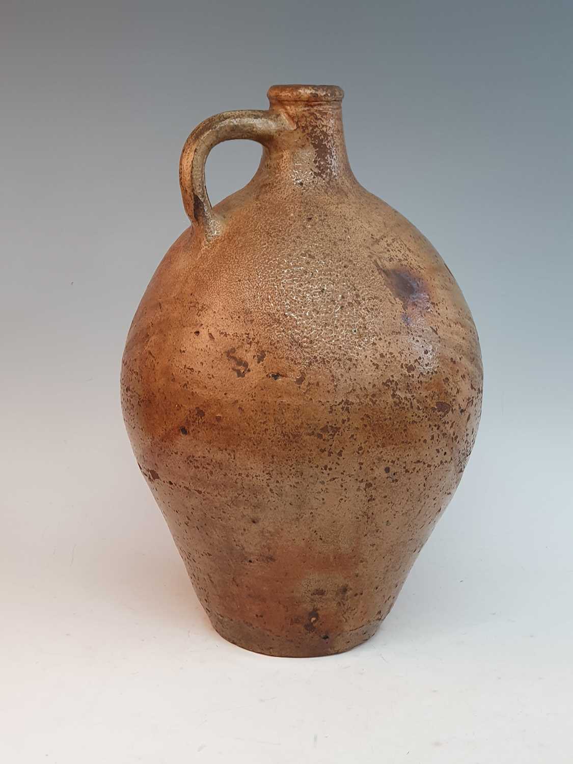 An early 18th century German salt glazed stoneware Bellarmine type flagon, of typical form, having a - Bild 4 aus 6