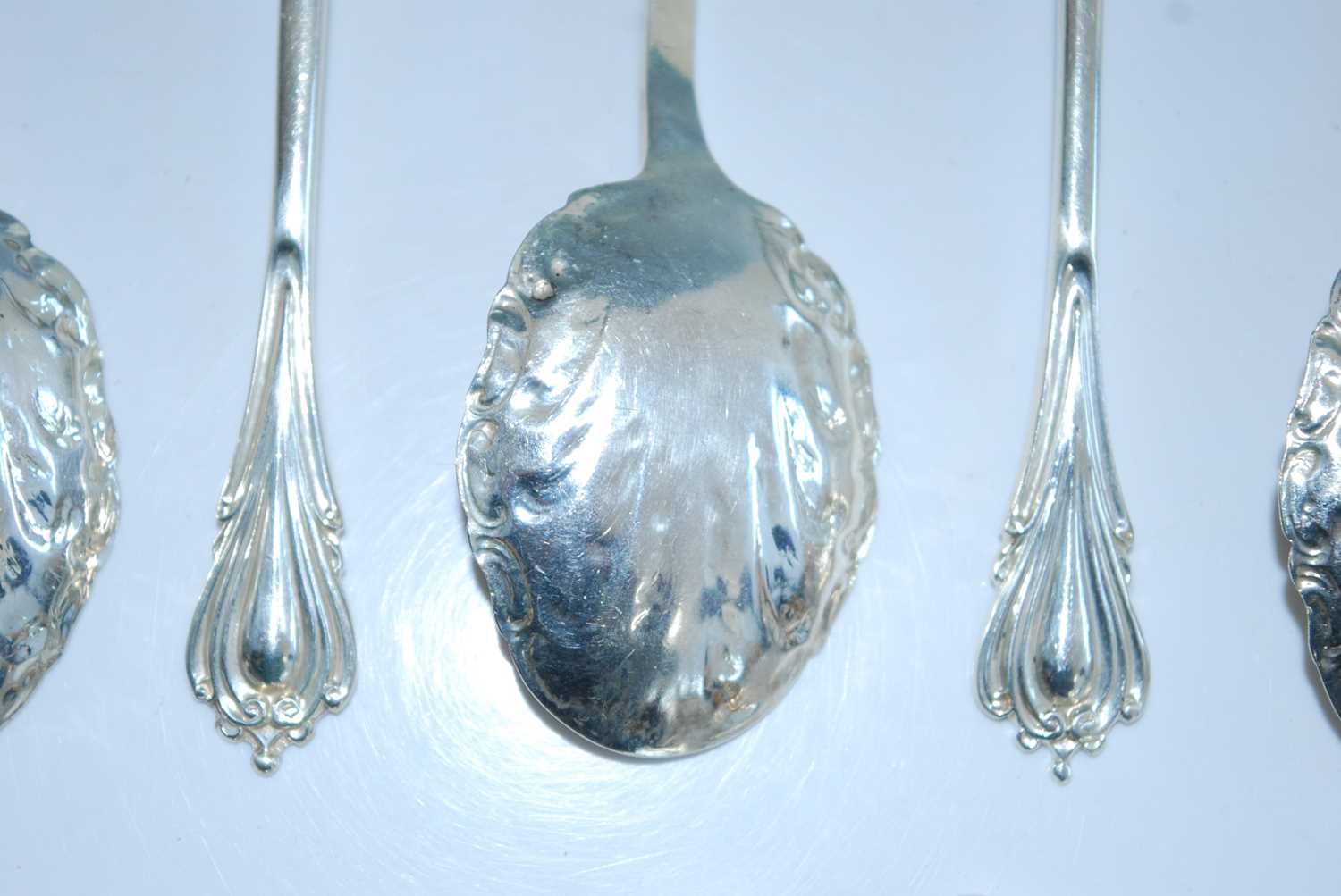 A matched set of fifteen early 20th century silver caddy spoons, the shaped scroll-edged bowls - Image 3 of 8