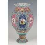 An early 20th century Chinese porcelain lantern and stand, enamel decorated in the famille rose