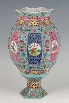 An early 20th century Chinese porcelain lantern and stand, enamel decorated in the famille rose