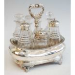 A George III seven-bottle silver cruet set, the holder of boat form with central stem decorative
