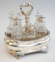 A George III seven-bottle silver cruet set, the holder of boat form with central stem decorative