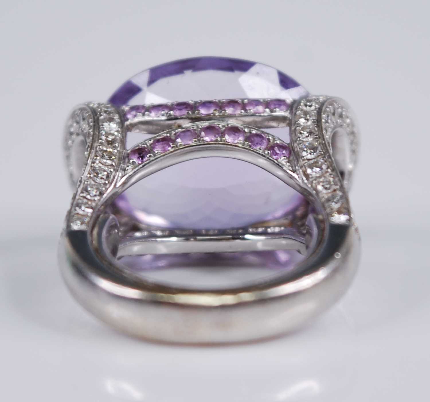 A contemporary French 18ct white gold, amethyst and diamond dress ring, arranged as a large oval cut - Image 6 of 6