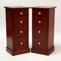 A pair of Victorian style mahogany bedside chests, each having four long graduated drawers and