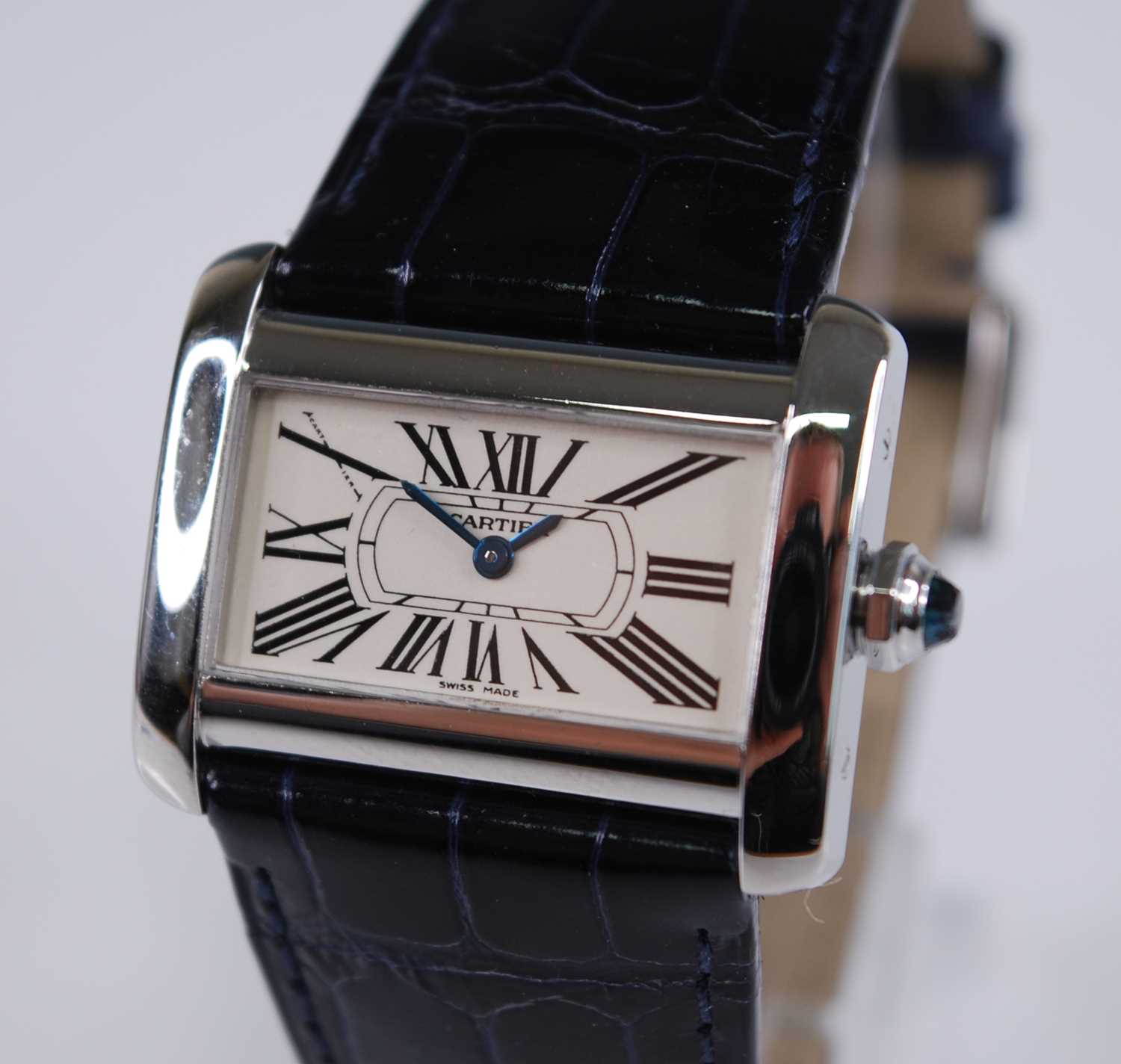 A lady's Cartier steel cased mini tank Divan watch, having a signed Roman dial, sapphire set crown