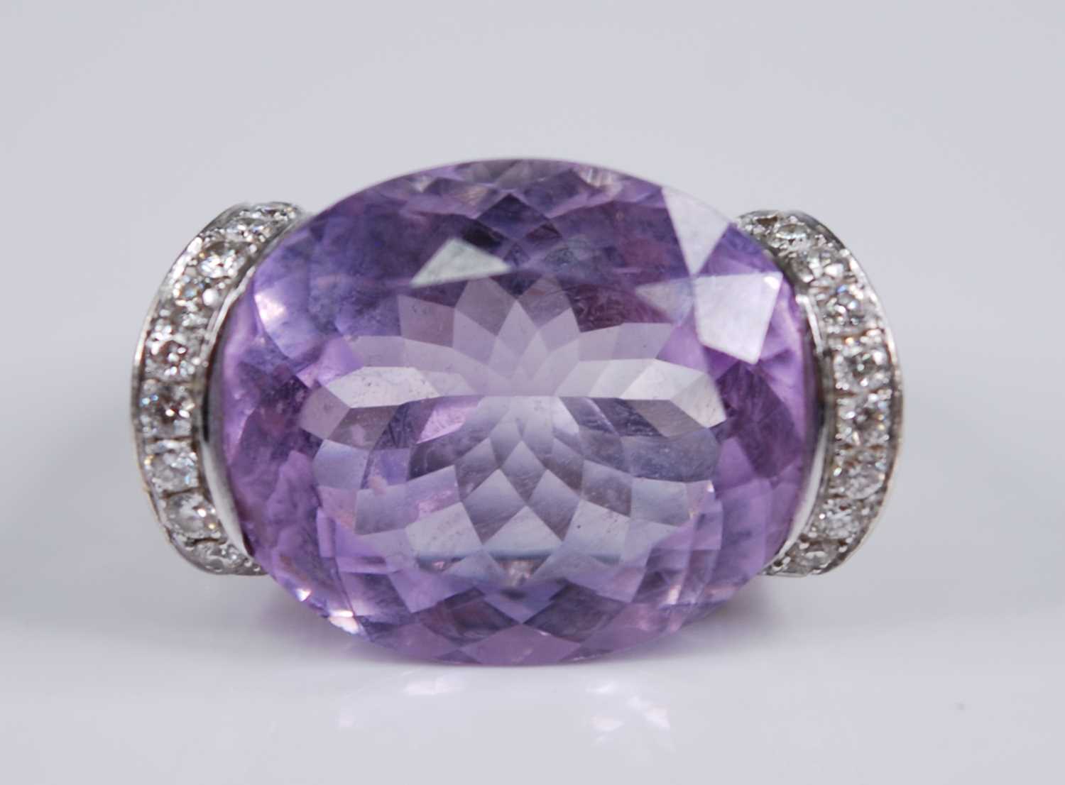 A contemporary French 18ct white gold, amethyst and diamond dress ring, arranged as a large oval cut - Image 2 of 6