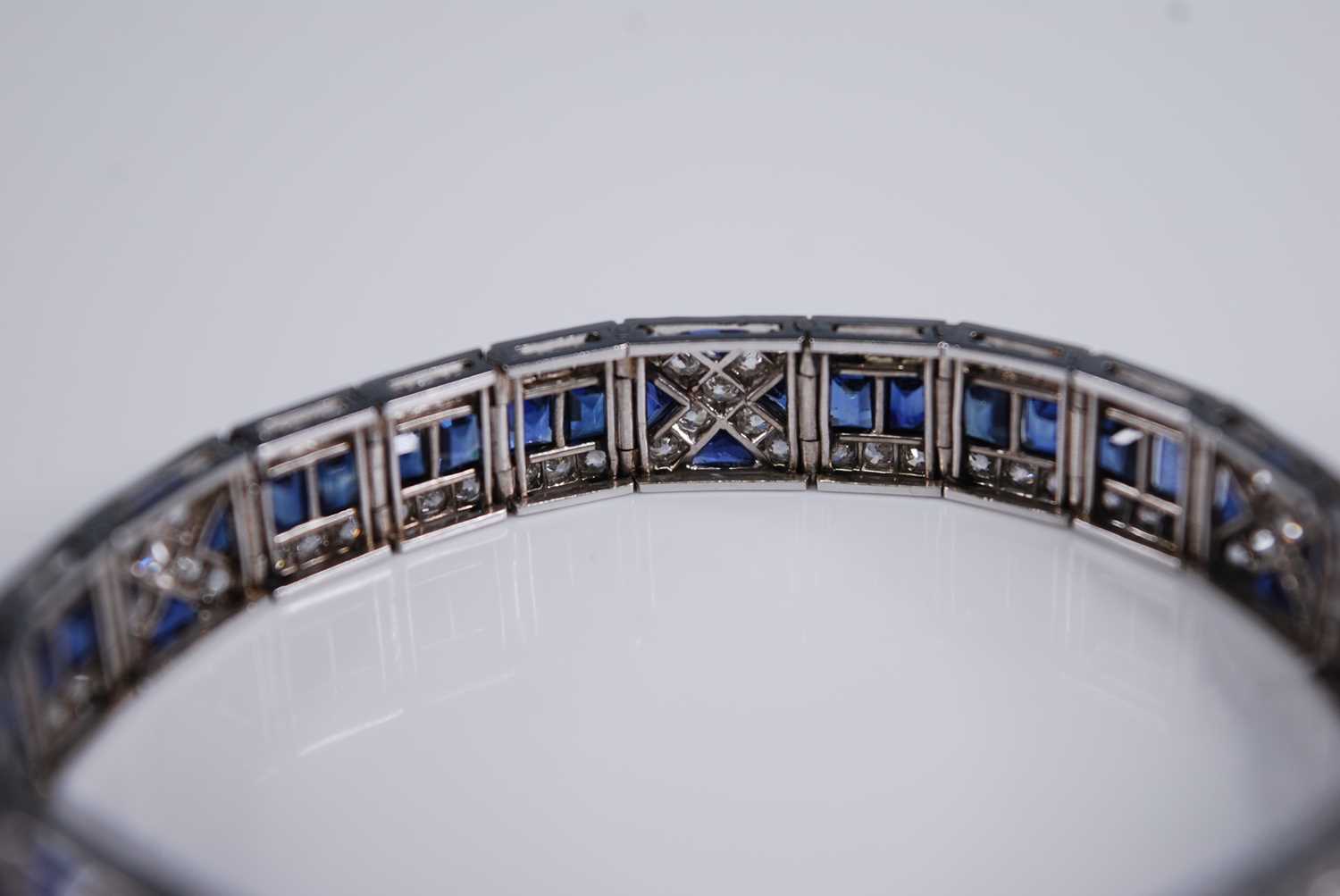 A white metal, sapphire and diamond Art Deco style articulated line bracelet, featuring 57 - Image 5 of 6