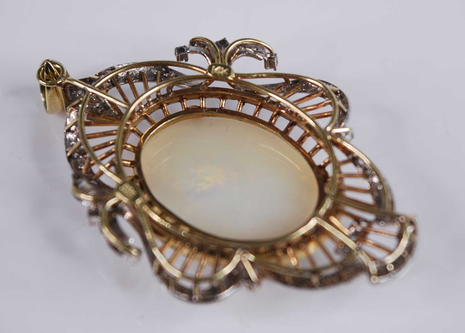 A yellow and white metal, opal and diamond openwork pendant, featuring a centre oval opal cabochon - Image 4 of 5