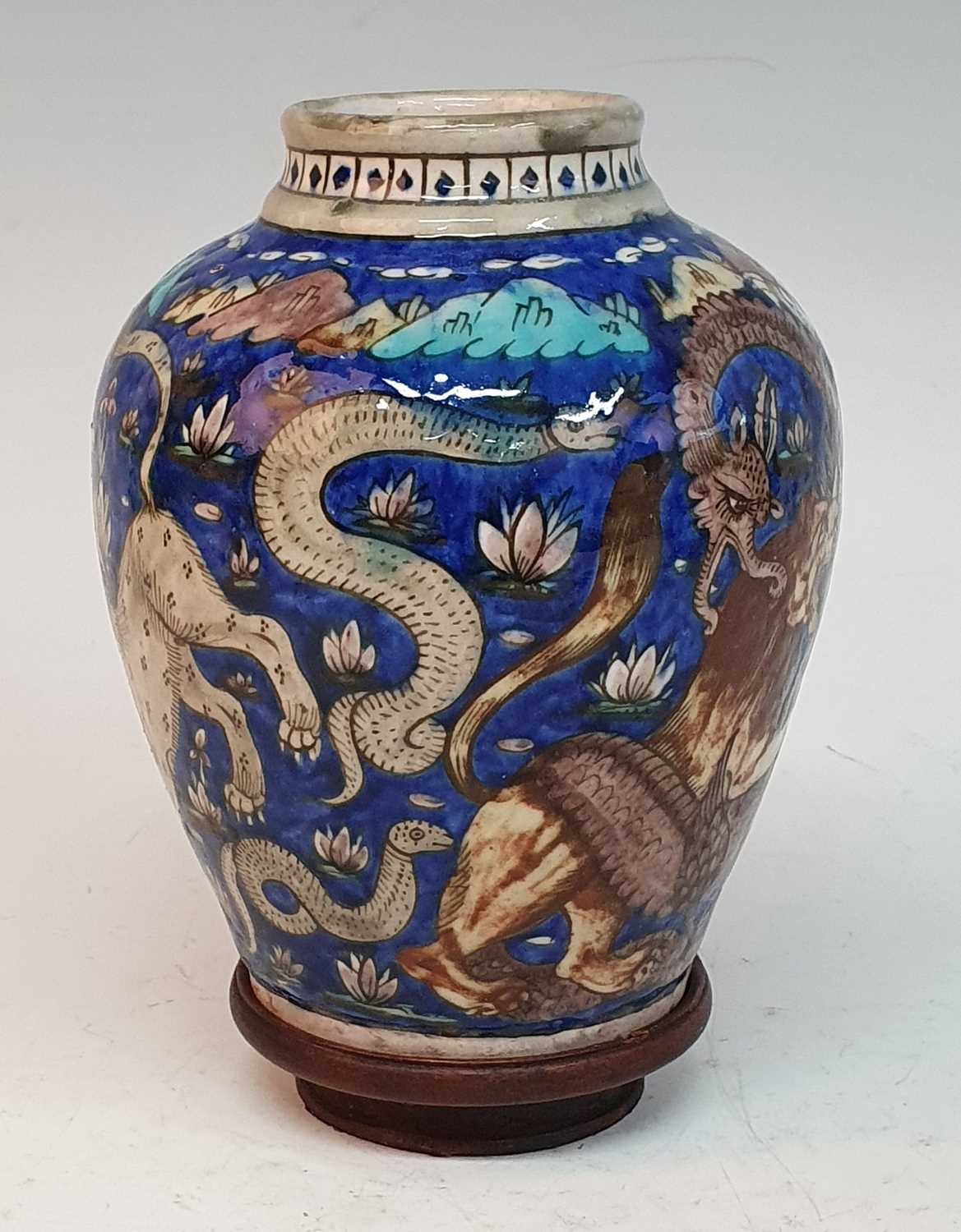 A 19th century Persian Qajar earthenware vase, decorated with fighting animals upon a cobalt ground, - Image 5 of 5