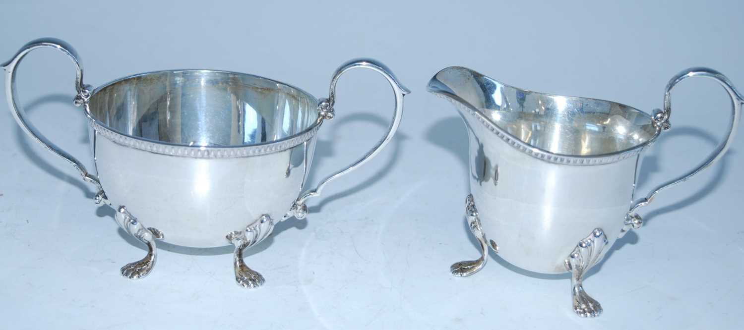 A mid-20th century silver four-piece tea set, comprising teapot, hot water pot, sugar and cream, - Image 9 of 10