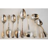 A harlequin set of 19th century silver spoons in the Fiddle pattern, comprising four tablespoons,