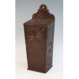 A George III oak candle box, profusely carved with geometric motifs, h.43cm