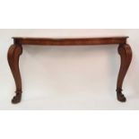 A Victorian oak serpentine front console table, the moulded top with pinched corners and raised on