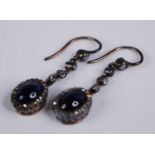 A pair of early 20th century sapphire and diamond set ear pendants, the blue sapphire cabochons each