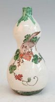 A Japanese Meiji period earthenware vase, of double gourd form, enamel decorated with a mouse