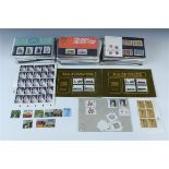 A large quantity of mint GB decimal stamp packs and further loose mint issues
