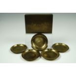 Six Indian enameled and engraved brass coasters together with a similar table cigarette box, circa