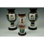 A pair of 19th Century enameled glass vases together with one other similar portraying Queen Mary,