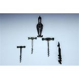 Two late 19th / early 20th Century cast steel combination corkscrews / tools together with three
