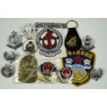 A Hong Kong Police cap and collar badges, key rings, a brass badge for Manila Police, No. 2628,