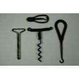 A simple wire corkscrew and advertising button hooks etc