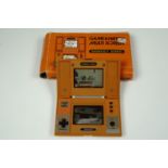 A boxed vintage 1980s Nintendo 'Game and Watch' multi-screen hand-held Donkey Kong video game