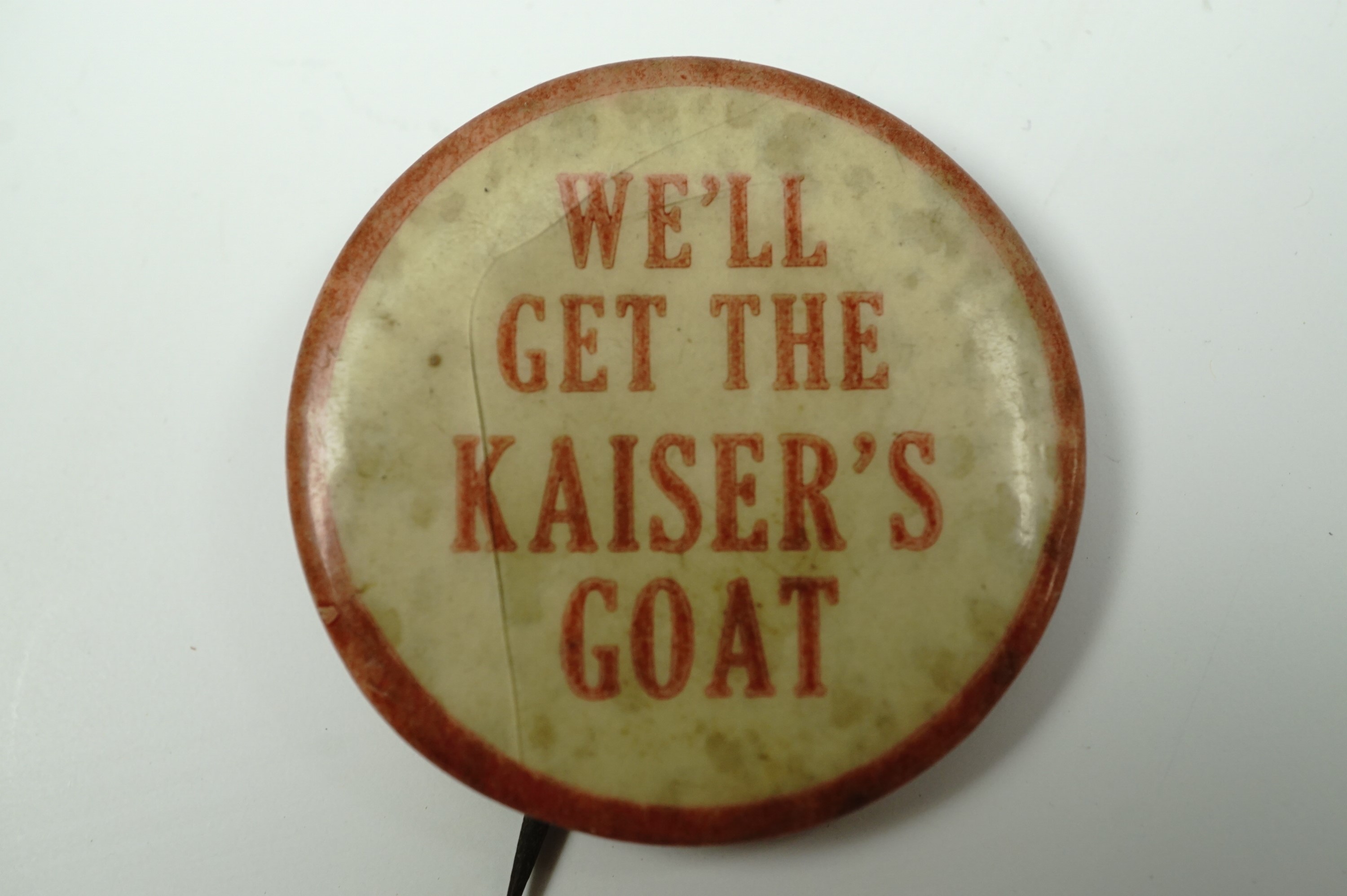A Great War anti-German button badge bearing the legend "We'll Get the Kaiser's Goat", 33 mm