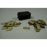 Two Napoleonic Prisoner of War type six spot miniature bone domino sets in a leather covered metal
