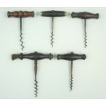 Five Victorian and later wooden handled corkscrews