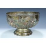 A late Victorian silver punch bowl, the bowl repouse worked and engraved with pronounced spiral