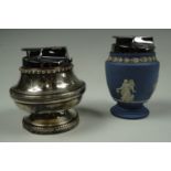 An electroplate table lighter having chased foliate decoration, together with a Wedgwood