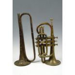 A vintage brass trumpet together with a cavalry type bugle