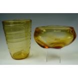 A large spiral trailed amber glass vase together with another of nobbly form, believed to be
