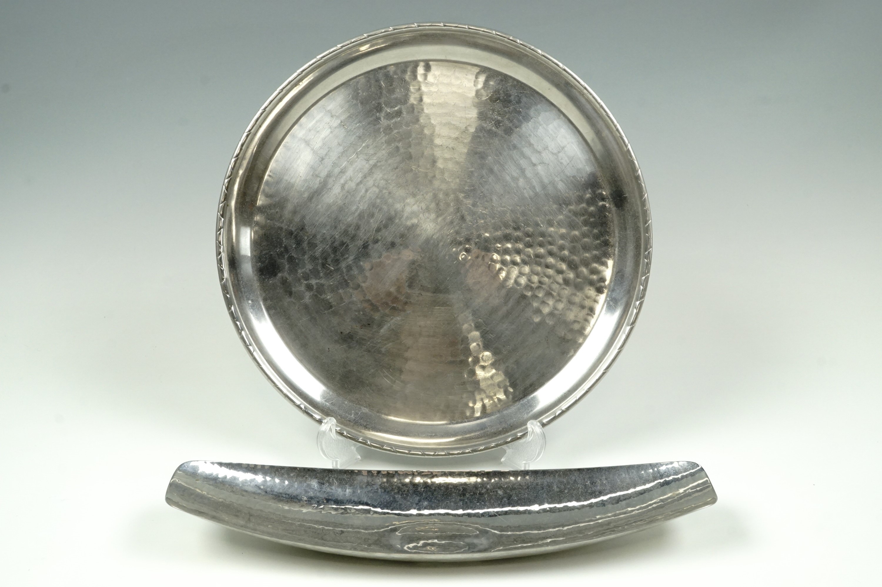 A Keswick School of Industrial Art dish 32.5 cm long together with a Lakeland Rural Industries