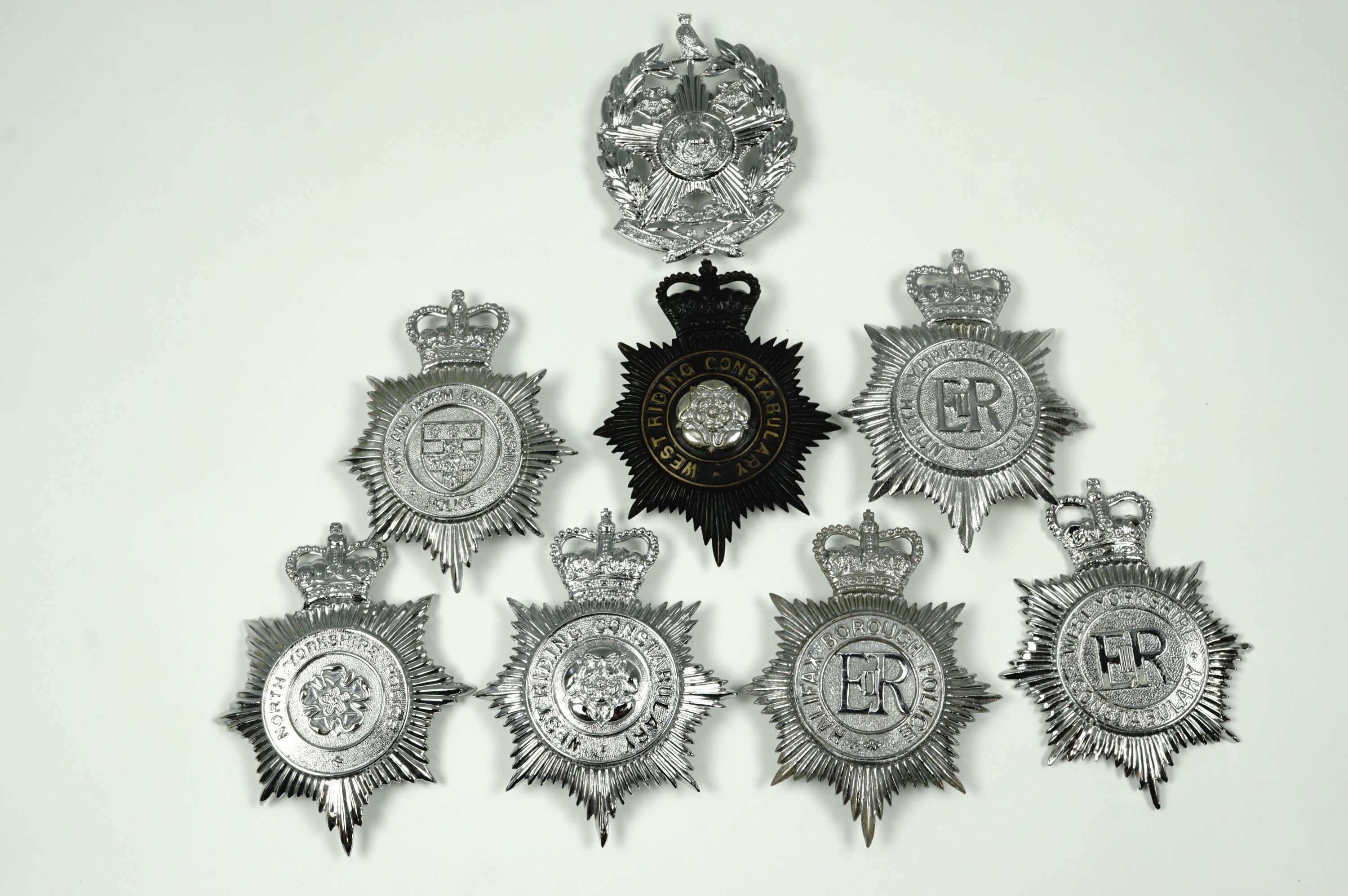 Eight British police helmet plates, Yorkshire police and constabulary, West Riding and Halifax