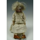 A Victorian Hamburger & Co bisque head doll having sleeping eyes and open mouth, 41 cm