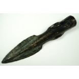 A Bronze Age cast looped socketed spear head, 13 cm long