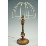 A carved and painted wooden lamp, 29 cm