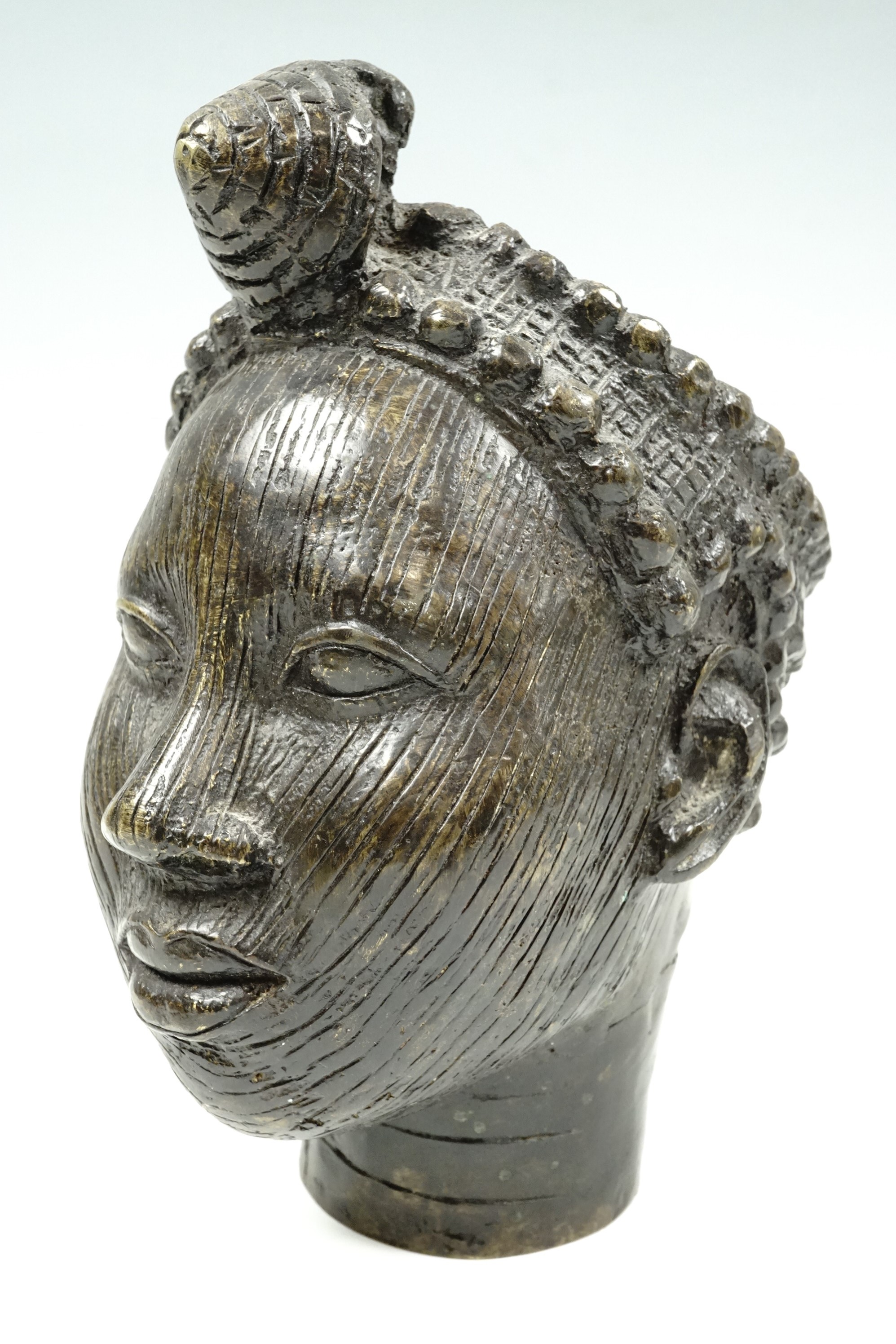 A Benin style cast female bust, 22 cm