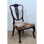 A late Nineteenth Century mahogany boudoir chair with cabriole legs and a pierced back spat, 45 x 45
